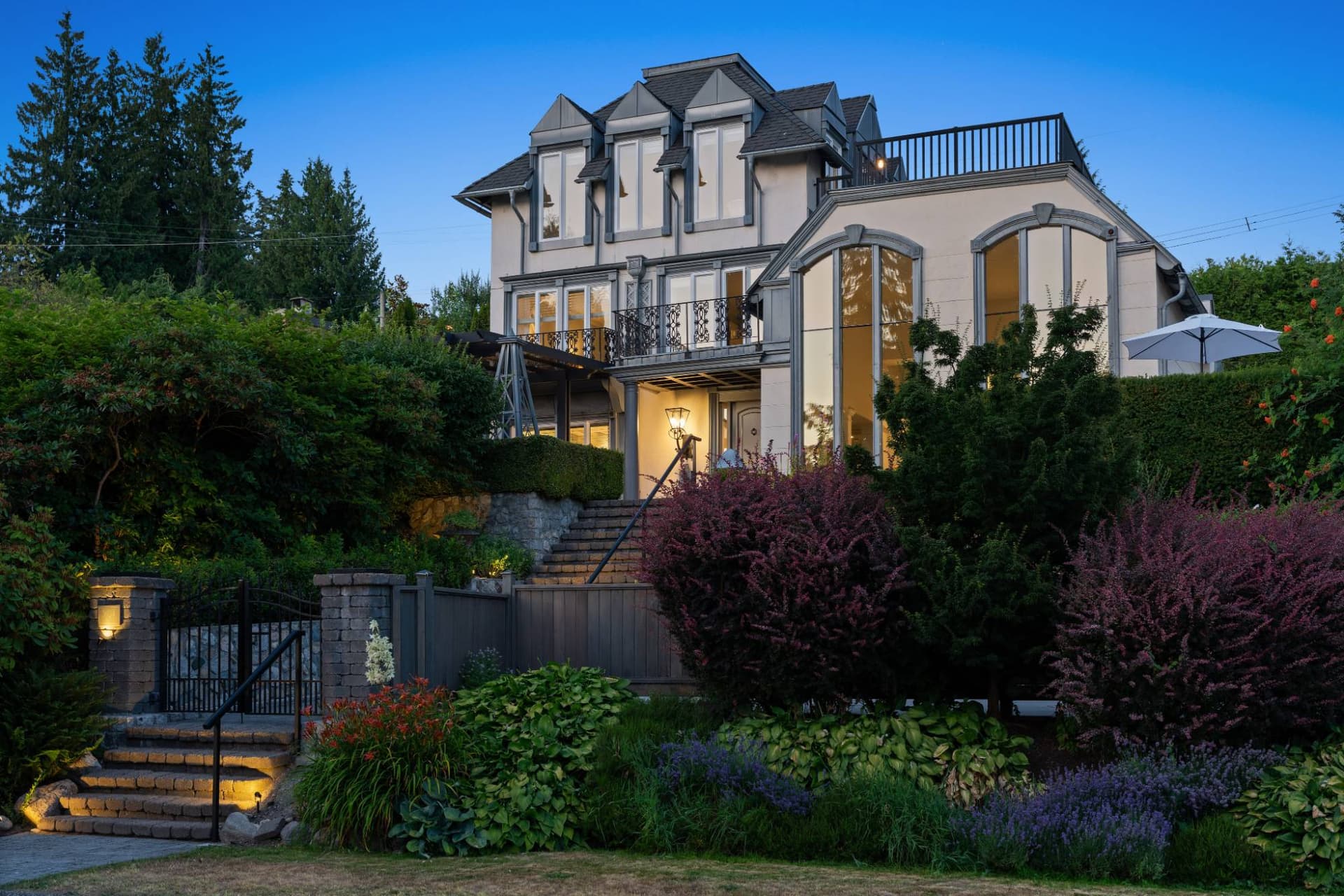West Vancouver home lit at dusk