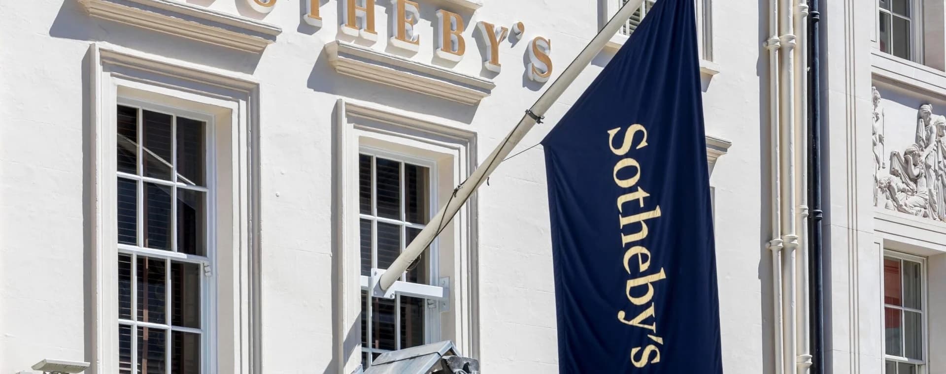 Sotheby's flag hanging from the Sotheby's building
